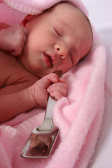 Image showing Baby born with silver spoon in her mouth