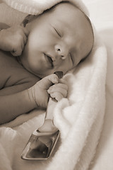 Image showing Baby born with silver spoon in her mouth