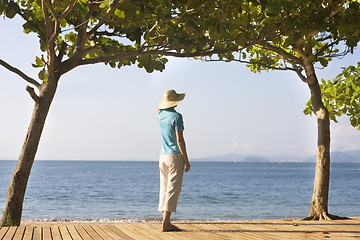 Image showing Woman with strawhat at the sea