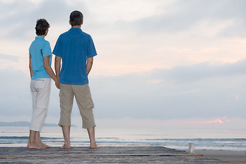 Image showing Mature couple contemplating the sunrise