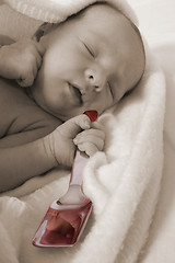 Image showing Baby born with silver spoon in her mouth