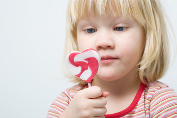 Image showing Cute little girl with a lollipop