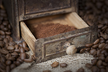 Image showing Detail of an old coffee grinder with coffee beans