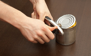 Image showing Opening the can