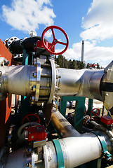 Image showing  industrial pipelines on pipe-bridge against blue sky