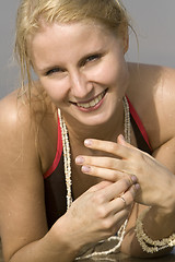 Image showing good looking woman rolling around in the surf