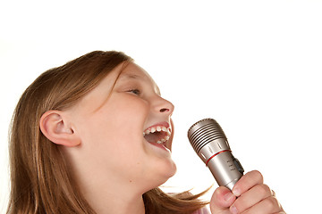 Image showing young girl singing karaoke on white