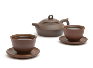 Image showing Two  cups of tea and brown teapot