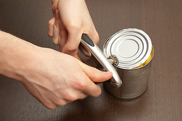 Image showing Process of opening the can