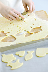 Image showing Cutting cookies from dough