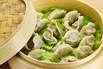 Image showing Bamboo steamer with dumplings