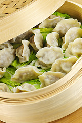 Image showing Bamboo steamer with dumplings