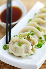 Image showing Steamed dumplings and soy sauce