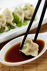 Image showing Steamed dumplings and soy sauce