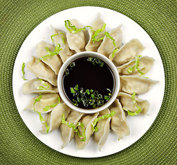 Image showing Steamed dumplings and soy sauce