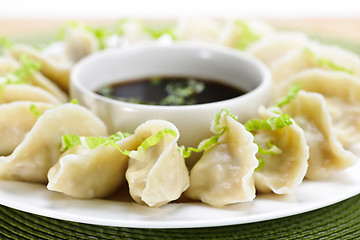 Image showing Steamed dumplings and soy sauce