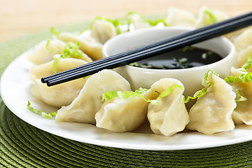 Image showing Steamed dumplings and soy sauce