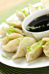 Image showing Steamed dumplings and soy sauce