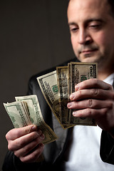 Image showing Man Counting Cash