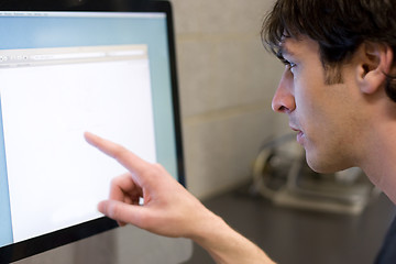 Image showing Man Pointing at Computer Screen