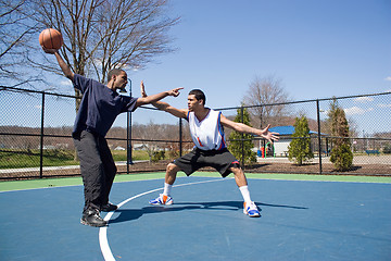 Image showing Men Playing Basketball