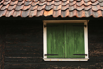 Image showing cabin window and tile roof