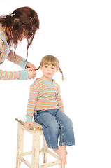 Image showing mom and daughter making braids