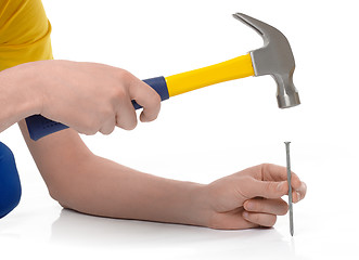 Image showing Hammering a nail