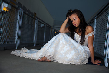 Image showing Beautiful bride sitting on floor