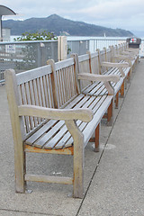 Image showing Row of benches on wharf