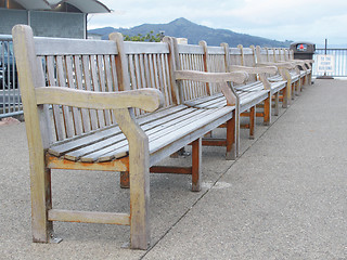 Image showing Row of benches on wharf