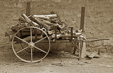 Image showing old cart with logs