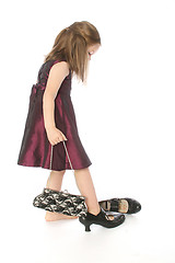 Image showing little girl trying moms shoes