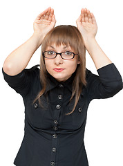 Image showing Girl has packed palm in the manner of ear