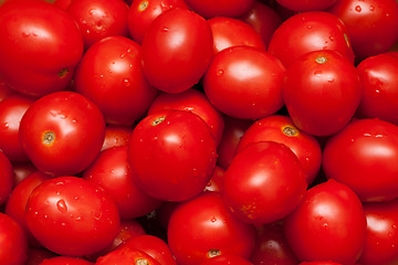 Image showing Red tomatoes by background