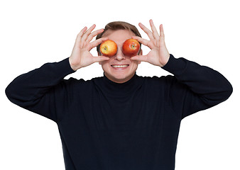 Image showing Man with apple on eye