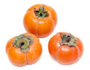 Image showing Three ripe persimmons