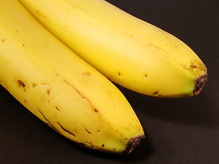 Image showing Bananas over black background-Natural,imperfect look.