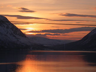 Image showing Dawn behind sea and mountains