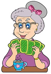 Image showing Old lady playing poker