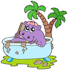 Image showing Hippo taking mud bath