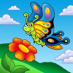 Image showing Cute butterfly with red flower