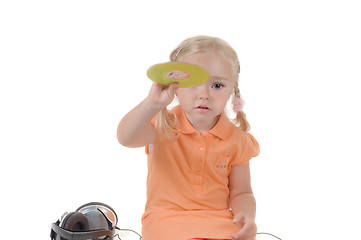 Image showing Shot of little girl with CD in studio