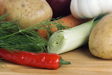 Image showing  vegetables  on a wooden kitchen board