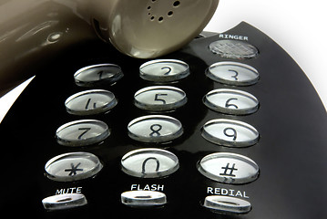 Image showing digits and speaker of a black telephone