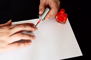 Image showing woman manicuring her nails