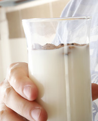 Image showing Young people eating milk with cereals