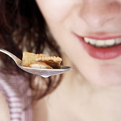 Image showing Young people eating milk with cereals