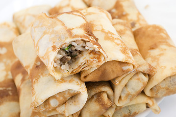 Image showing pancakes with meat and rice