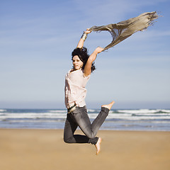 Image showing pretty happy girl jumping